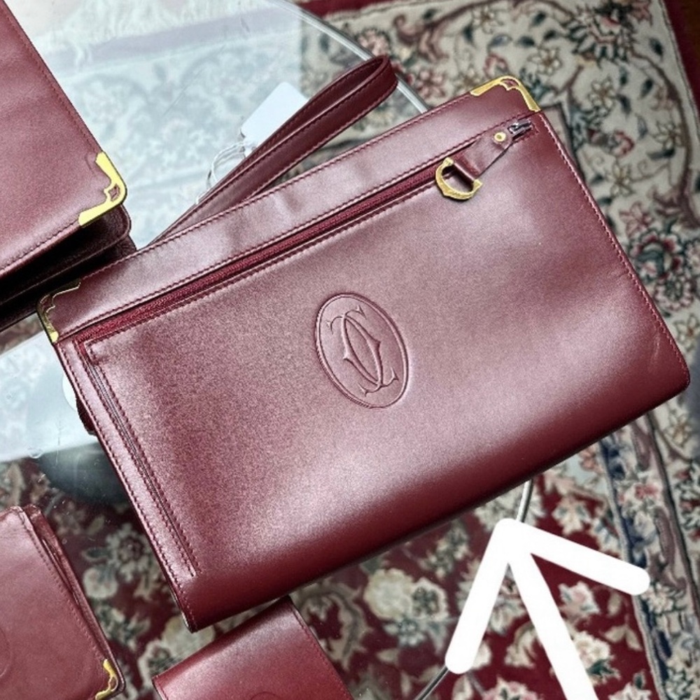 Cartier Burgundy Leather Wristlet Clutch with Gold Hardware